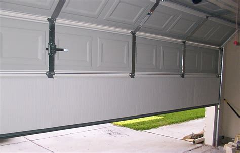 replace garage metal door to enter house|how much are garage doors.